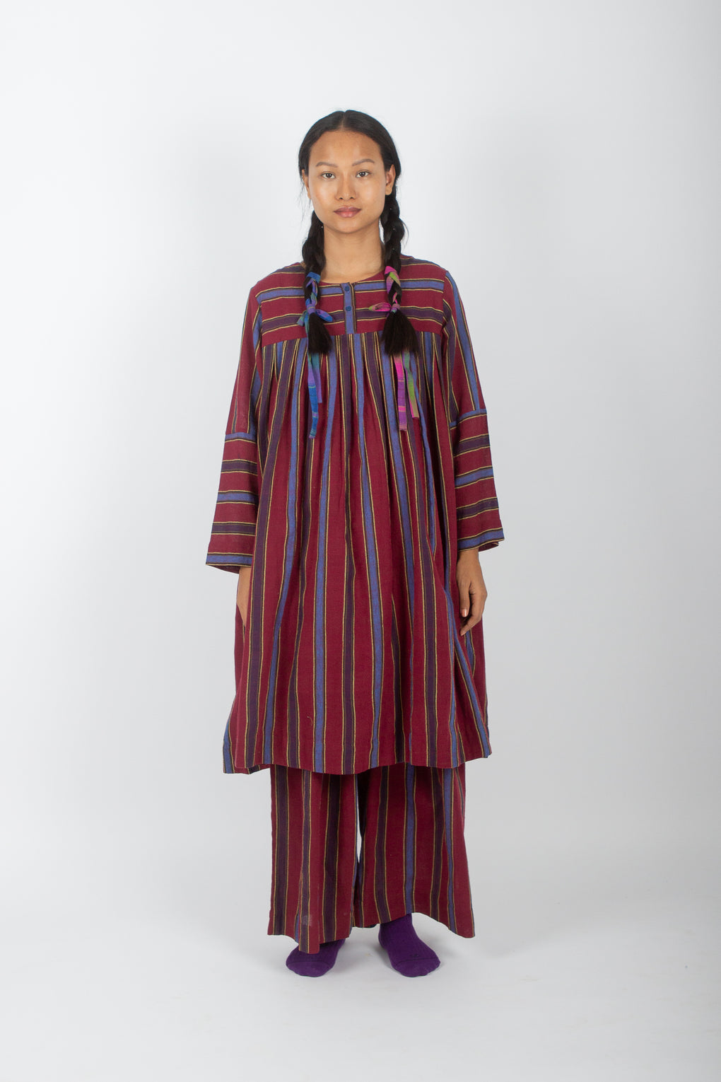 Model wearing handwoven organic cotton dress
